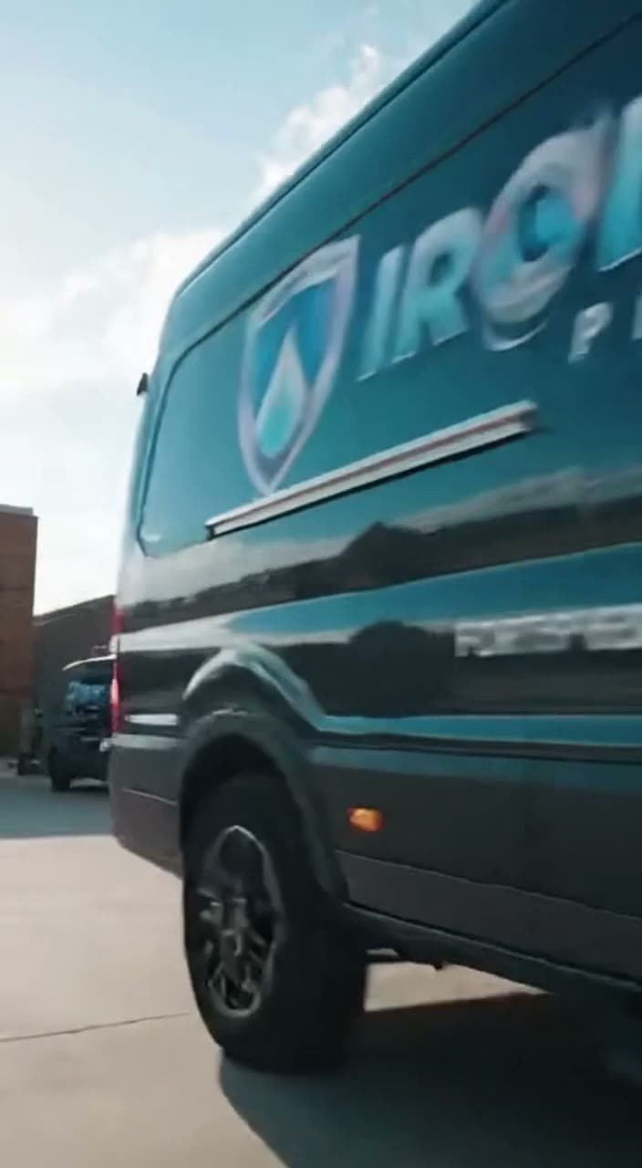 Ironclad Plumbing service van parked in Austin